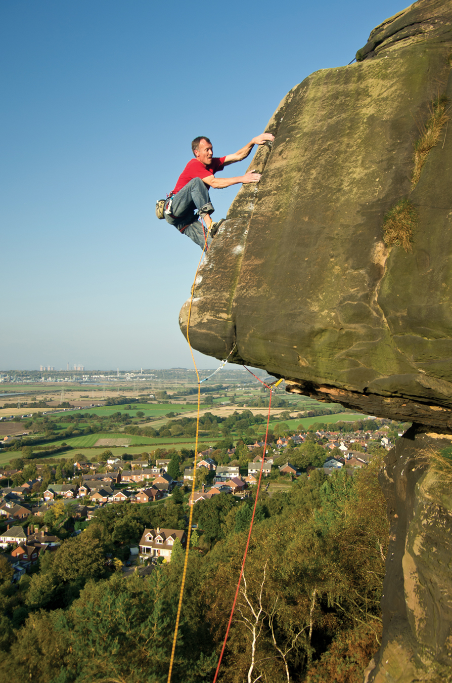 Pete Chadwick on Yuppies Arête at Helsby. This is the front cover of the BMC’s Cheshire & Merseyside Sandstone guidebook. Photo: Paul Evans