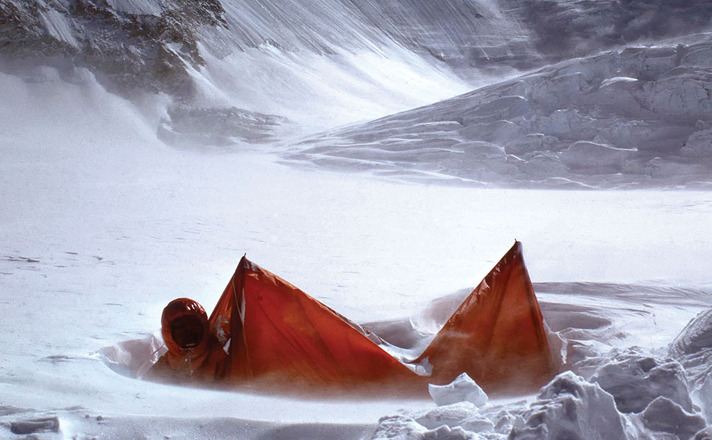 Hamish emerges from an avalanched tent on the 1975 South West Face of Everest expedition. Photo: Hamish MacInnes Collection