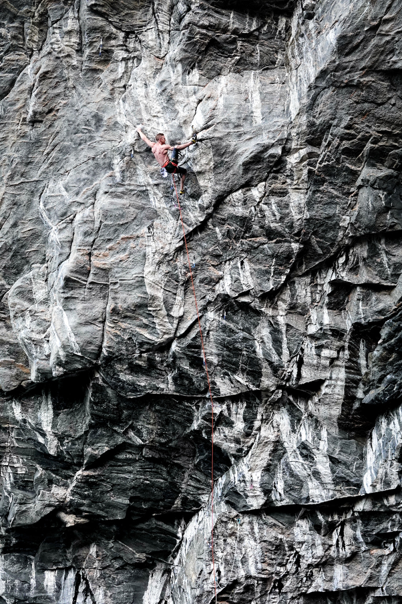 Jakob Schubert during an unsuccessful attempt in mid-September on Project Big; the scale of the route as well the long powerful moves required - in this case on the crux of the route - are self evident. Photo: Keith Sharples