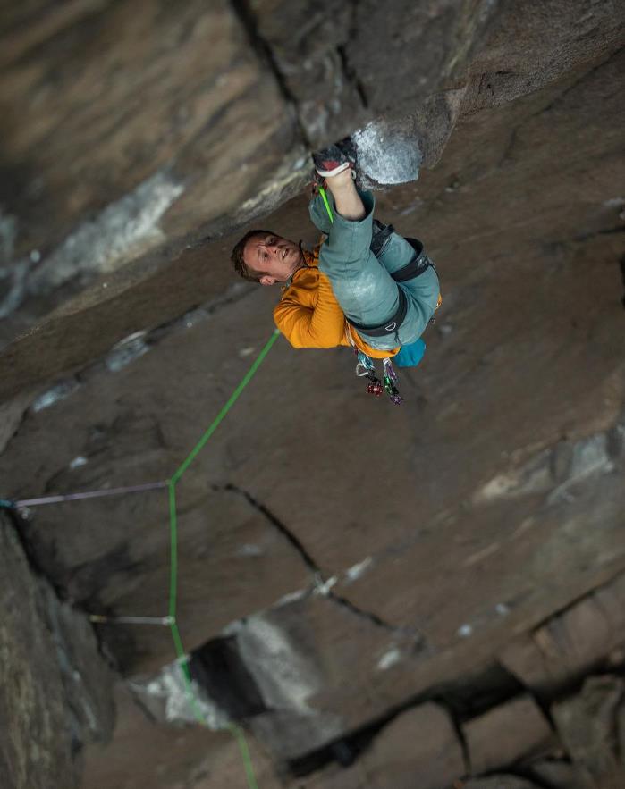 Pete Whittaker on Crown Royale, his hardest route yet. Here Pete is hanging in the 'bat-hang' rest midway up the second pitch on Eigerdosis. Photo: Andrew Burr/Patagonia