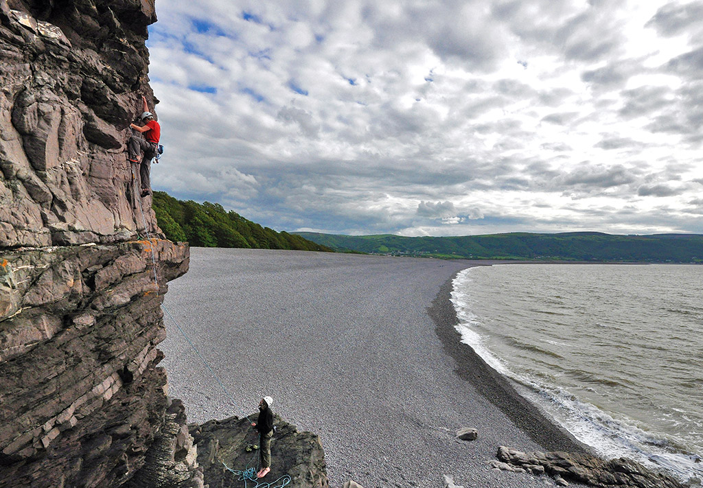 James Rich climbing Evening Crack (S) on the Bossington Beach Crag. Photo: © Mark Davies