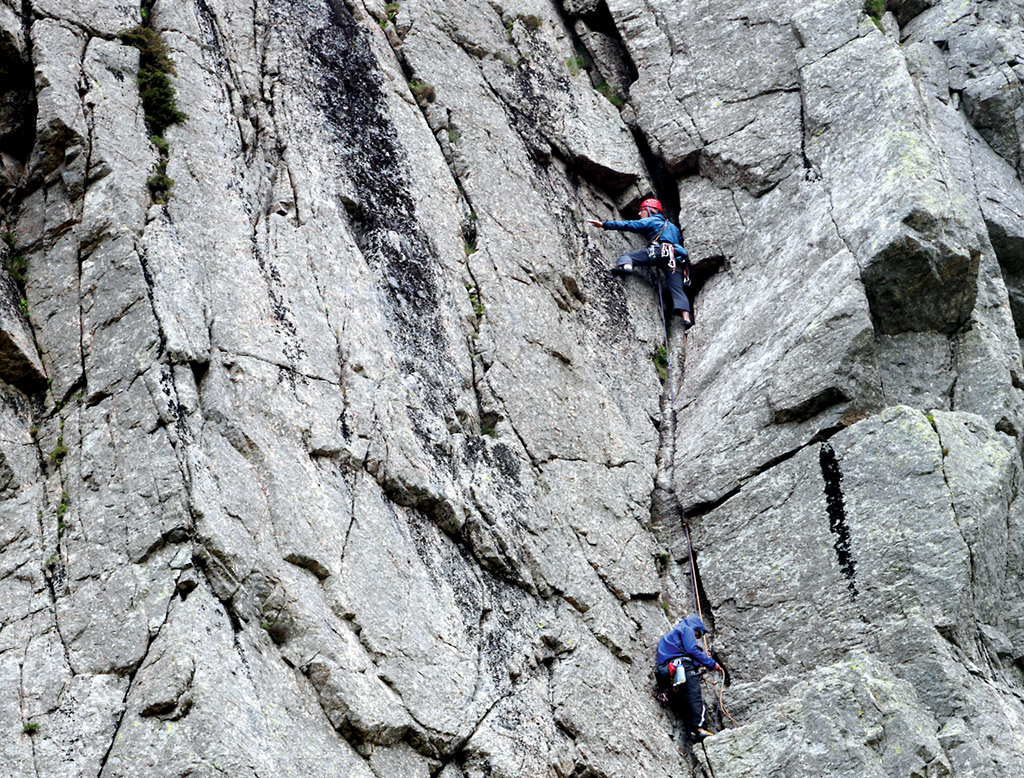 Climbers on the final pitch of The Crack at Gimmer. This uber classic VS gives three pitches of 4c climbing with this pitch often considered the hardest. Photo: © David Simmonite