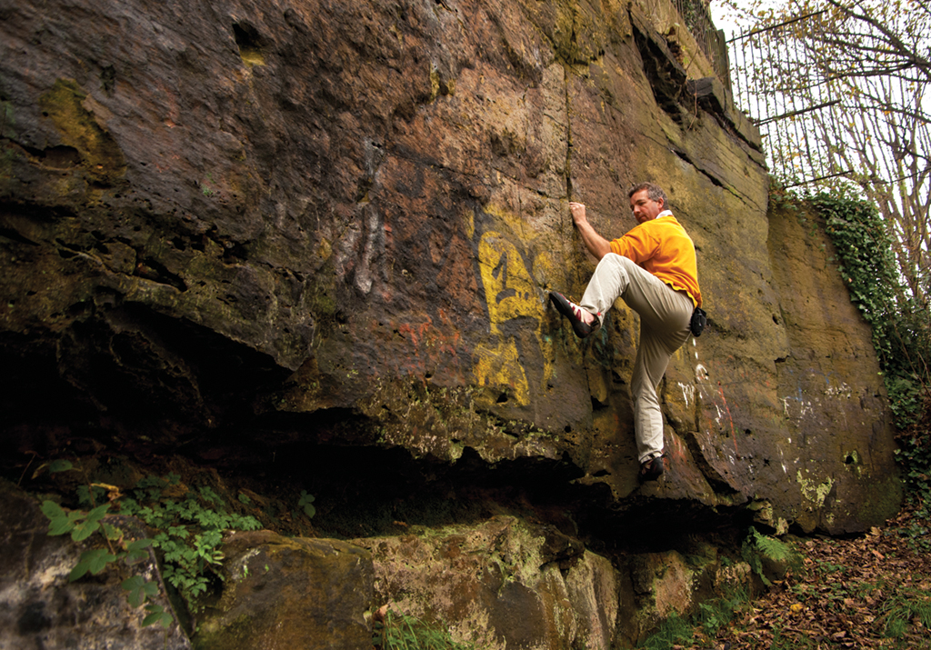 Jim Symon bouldering on Bluebell Wall, The Breck. Photo: Paul Evans