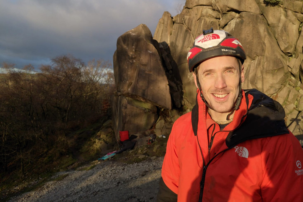 James Pearson after his ascent of Harder, Faster that can be seen in the background alongside Gaia. Photo: David Simmonite