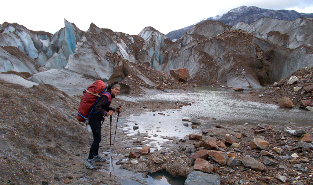 Sílvia Vidal hauling her kit into the West Face of Cerro Chileno, seen in top centre of the image. Photo: © Silvia Vidal