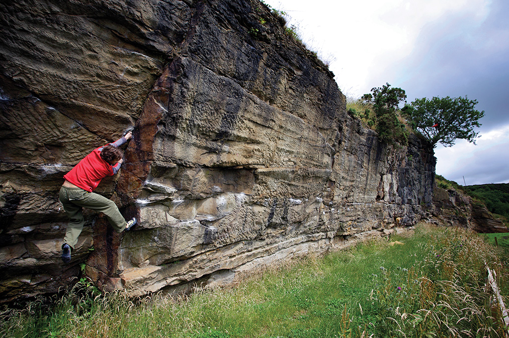 Yann Genoux boulders out the awkward but worthwhile corner of New Stone Age (V2) towards the right-hand end of Longridge where the angle eases. Photo: © Davd Simmonite